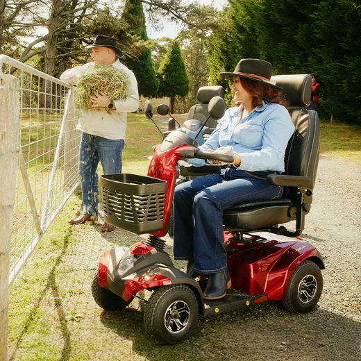 A woman driving an Oscar Scooter