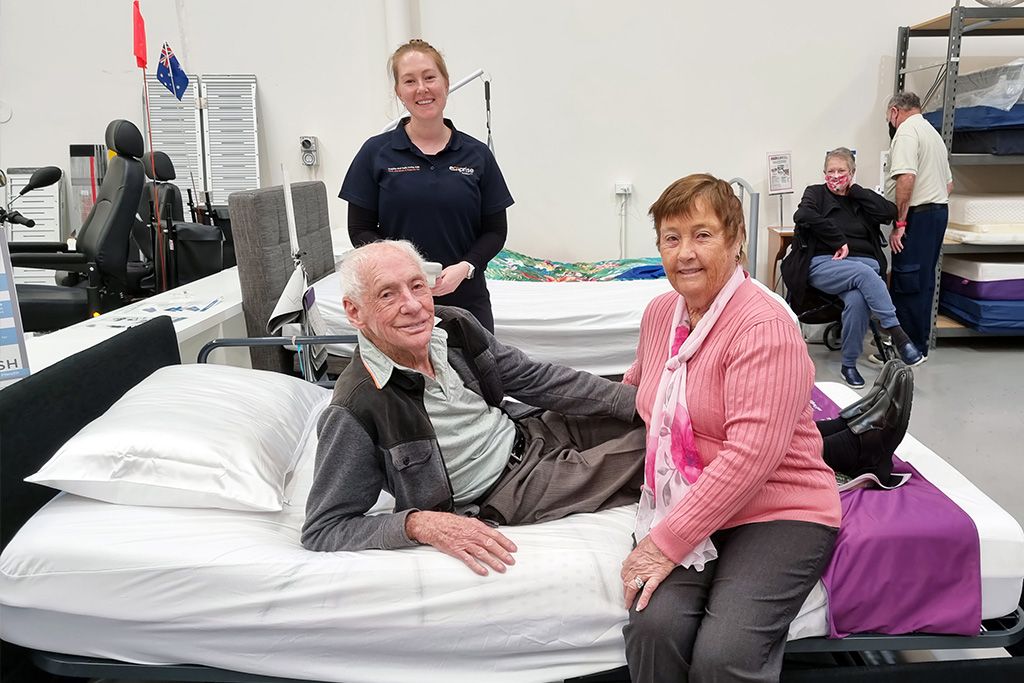 Couple with Emprise OT trialling bed