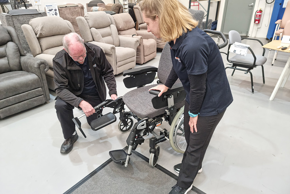 Editing-Shaun-OBrien-owner-with-trainee-OT-Rebecca-Dowell-prepping-wheelchair-for-trial