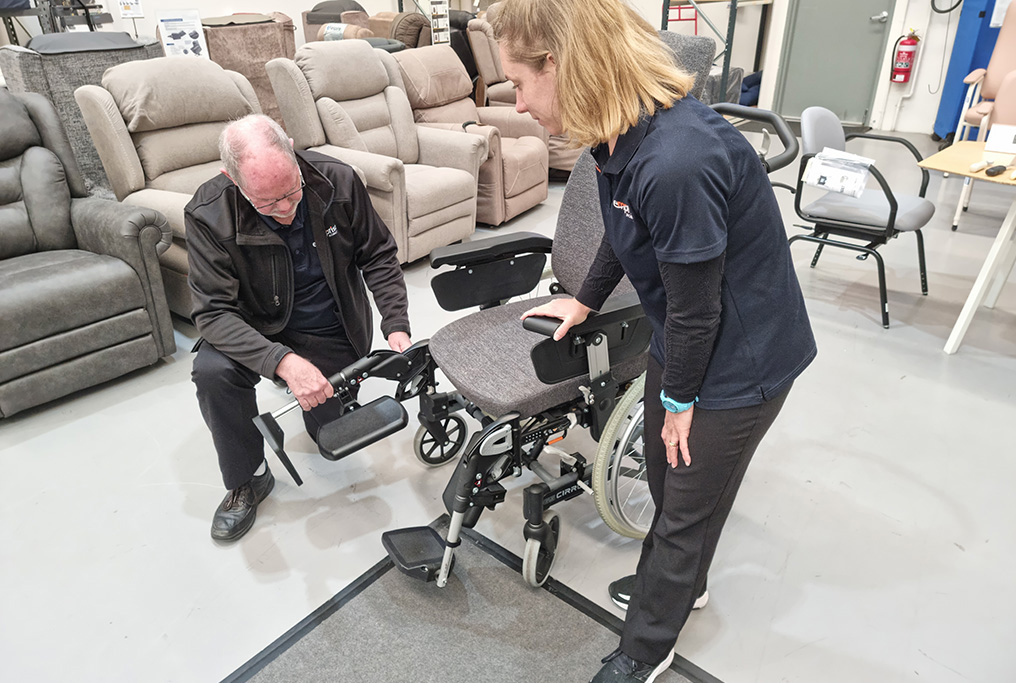 Editing-Shaun-OBrien-owner-with-trainee-OT-Rebecca-Dowell-prepping-wheelchair-for-trial Editing-Shaun-OBrien-owner-with-trainee-OT-Rebecca-Dowell-prepping-wheelchair-for-trial