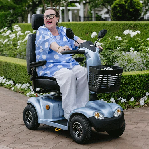 A woman driving a Sierra Scooter