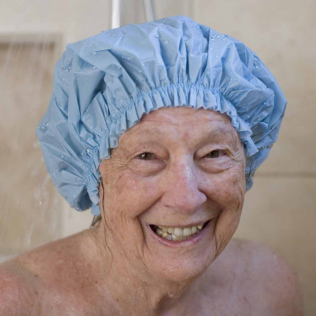 A woman wearing a shower cap
