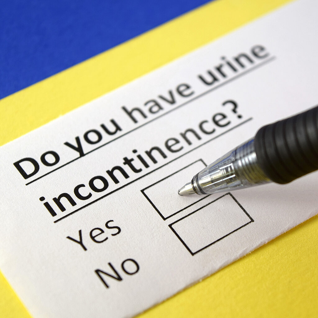 Close up of a pen completing a Continence Management Checkbox