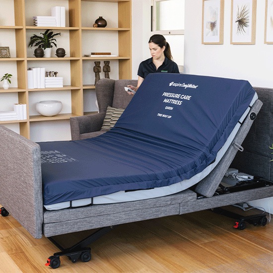 Occupational Therapist adjusting a ComfiMotion bed